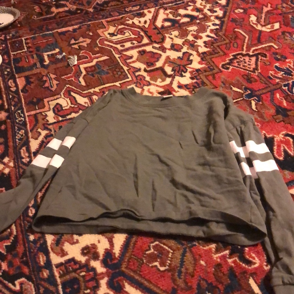 A green cropped long sleeve shirt